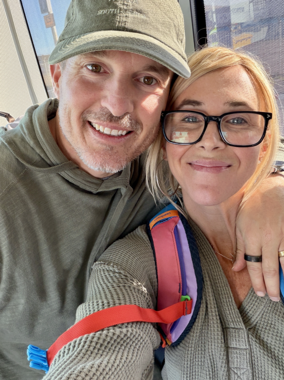 a living room with a couch and a table and a fireplace