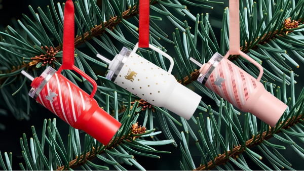 three christmas stanley ornaments hanging on a christmas tree