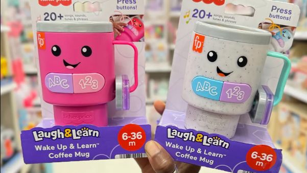 a person holding two cups with faces on them