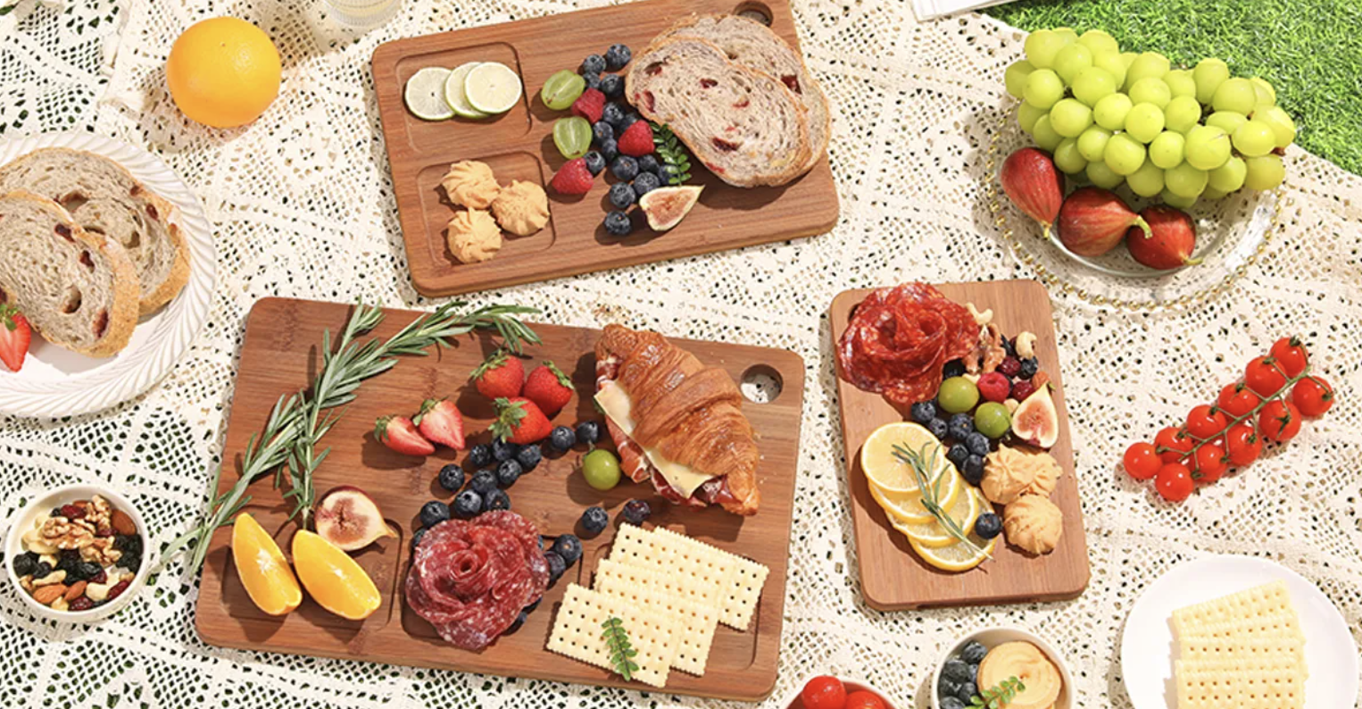 a variety of food laid out on wooden cutting boards