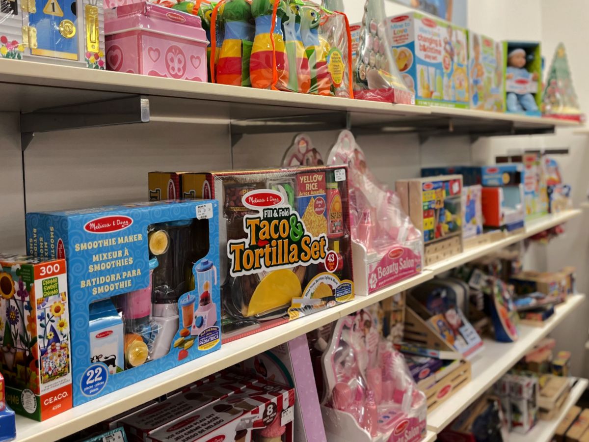 a shelf full of toys on a shelf in a store