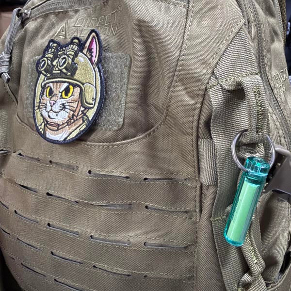 you can hang on your backpack for easy identification at night