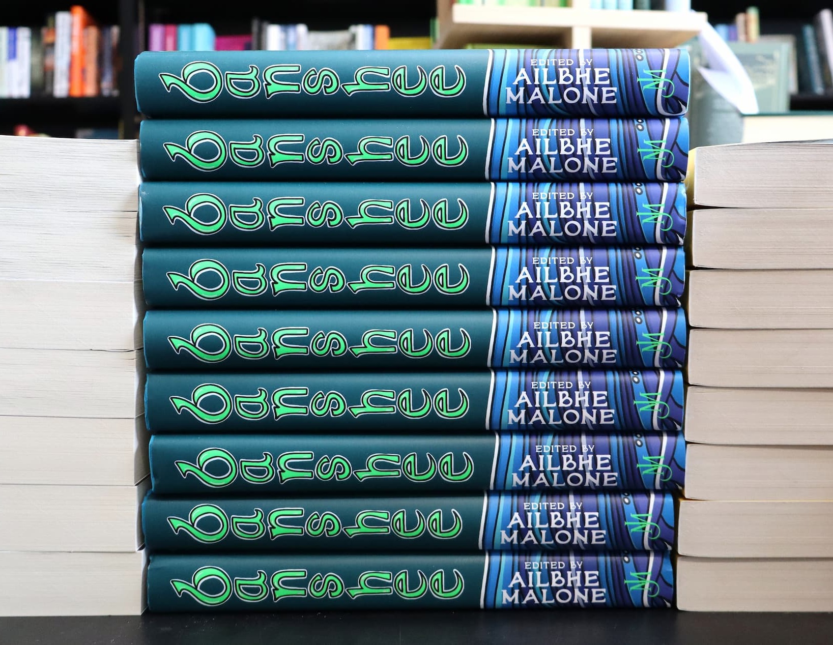 an image of a stack of books sitting on top of a table