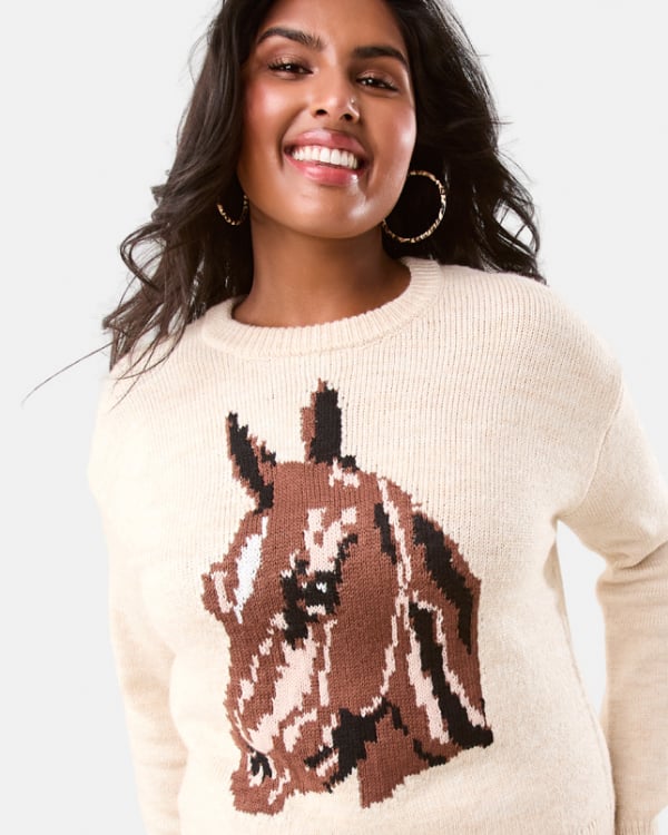 Jacquard horse jumper. Sizes: 6-20. $27. Asymmetrical flannel skirt. Sizes: 6-20. $29. Tall heel boot. Sizes: 5-11. $45.
