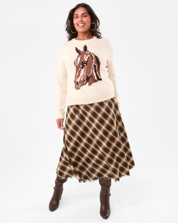 Jacquard horse jumper. Sizes: 6-20. $27. Asymmetrical flannel skirt. Sizes: 6-20. $29. Tall heel boot. Sizes: 5-11. $45.