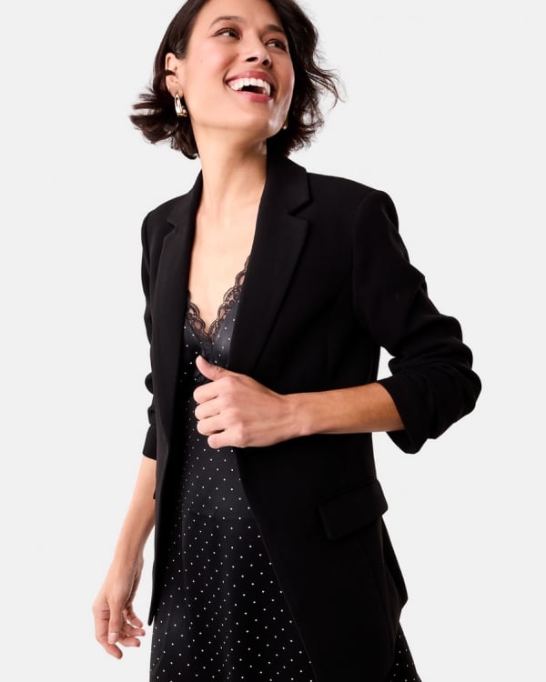 Slingback kitten heel. Sizes 5-11. $25. Fitted waist blazer. Sizes: 6-20. $42.