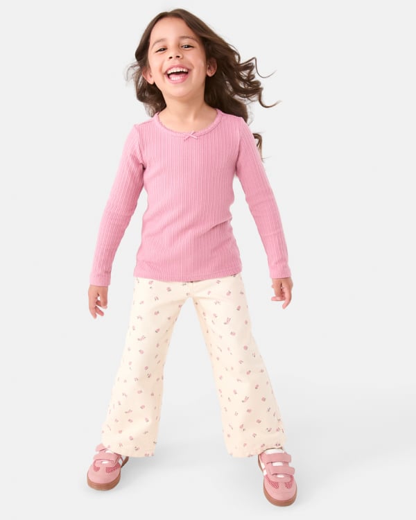 Printed wide leg jean. Sizes: 1-9. $22.