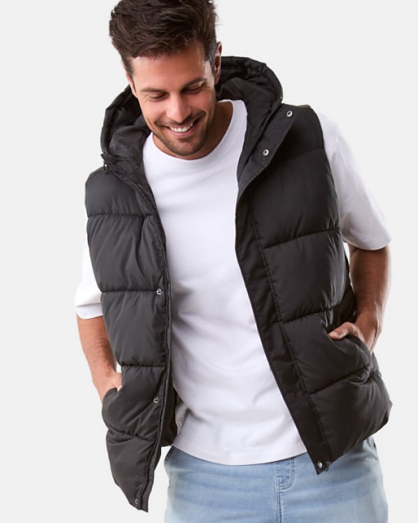 Hooded puffer vest. Sizes: XS-4XL. $30. Cuffed denim jogger. Sizes: 28-44. $35