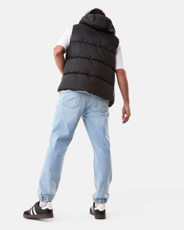 Hooded puffer vest. Sizes: XS-4XL. $30. Cuffed denim jogger. Sizes: 28-44. $35