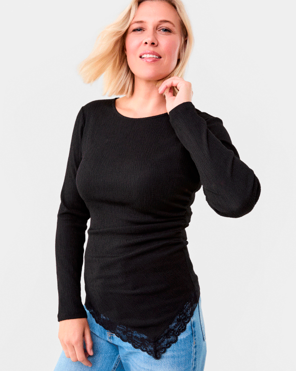 Long sleeve asymmetric lace trim top. Sizes: 6-20. $17ea.