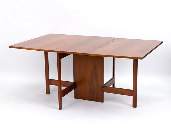 Small gate leg dining table by George Nelson for Herman Miller. Features a wide wooden hinge with