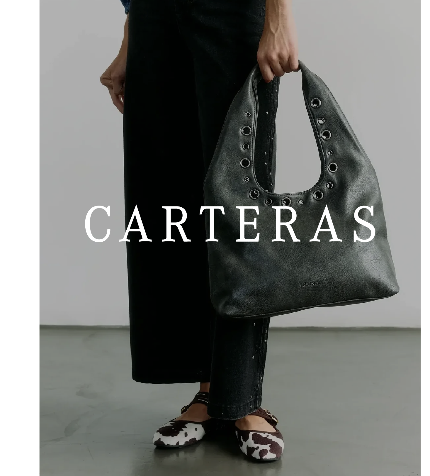 an image of a woman holding a black bag with the word carterass