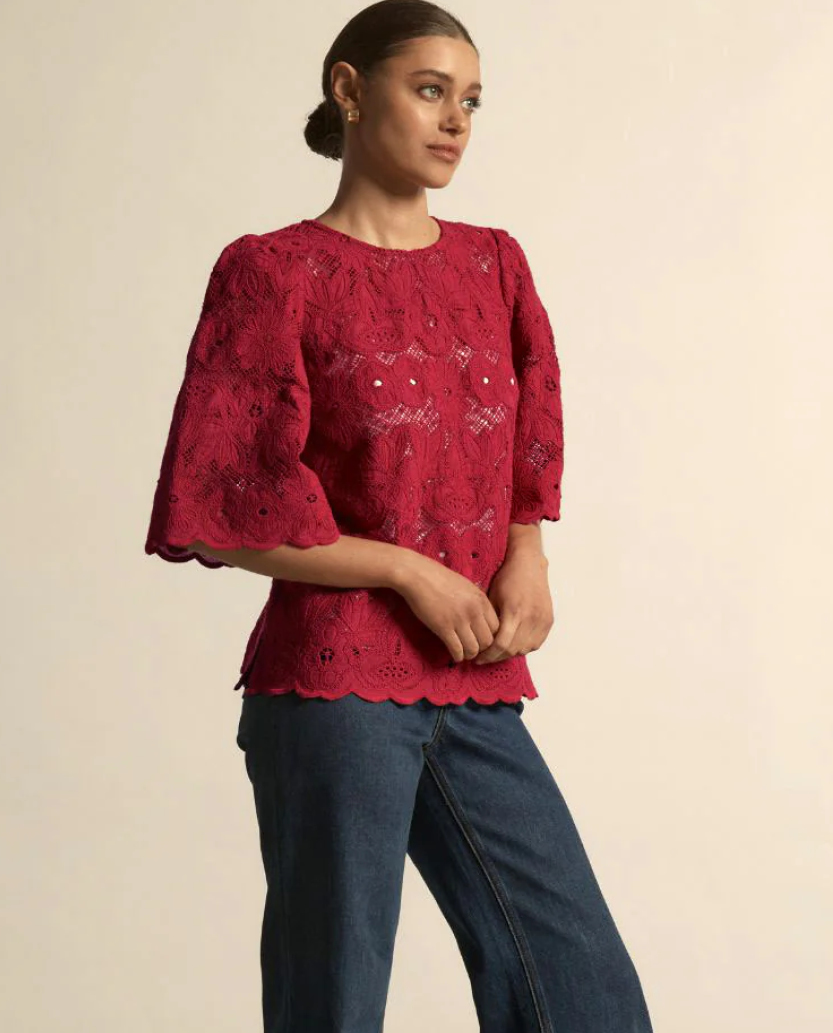 Glisten Top.  Vintage-inspired Cotton lace presented in warm Raspberry, the volume in the bell sleeve brings modernity to an otherwise classic silhouette.   Sizes to fit 10-18.