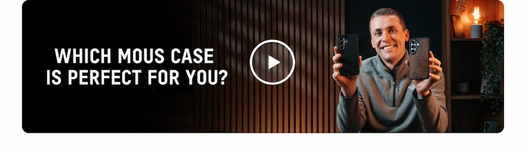 an image of a man holding a cell phone in his hand