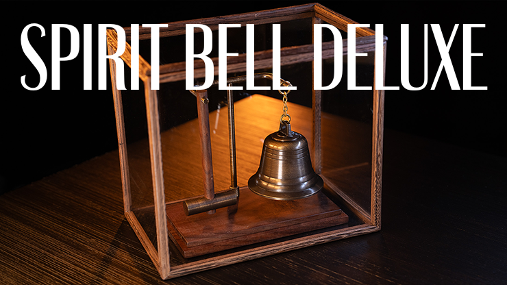 an image of a bell is sitting in a wooden box