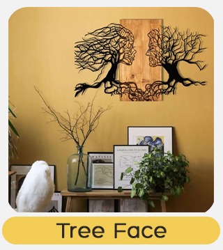 Metal wall art of two facing trees forming faces over wooden panel on mustard wall above shelf with plants, books and vase