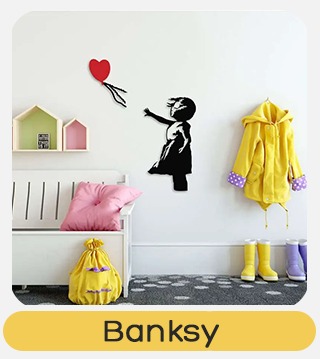 Child's bedroom with black stencil girl reaching for red heart balloon on wall, yellow coat and wellies, pink cushion