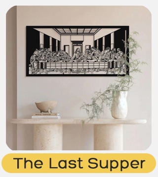 Black metal cutout wall art of The Last Supper above a minimalist console table with decorative vase and bowl