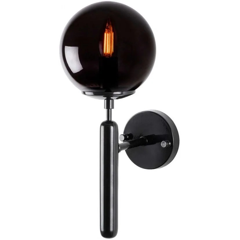 Black wall sconce with smoked glass globe and exposed filament bulb mounted on a cylindrical metal arm