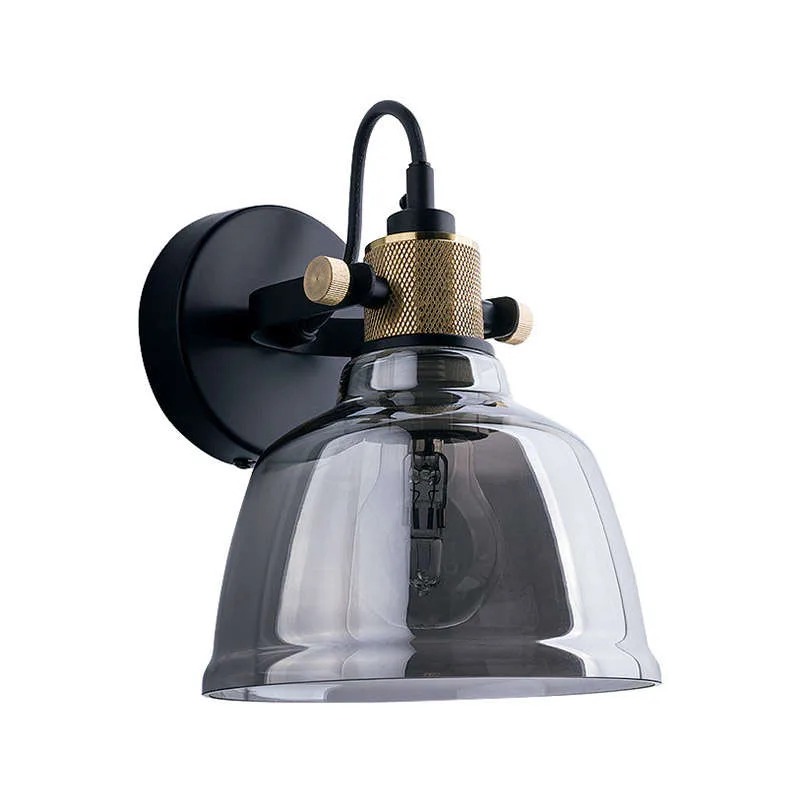 Industrial black and brass wall light with smoked glass bell shade and visible filament bulb