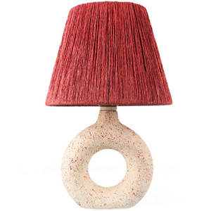 Round ceramic table lamp with speckled white doughnut base and textured red fabric shade