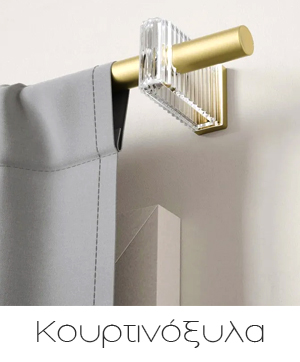 Gold metal curtain rod with clear crystal bracket and grey curtain panel on a white wall, modern curtain hardware