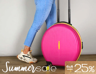 Legs in jeans and trainers pulling a bright pink round suitcase with telescopic handle on a wooden floor; 'Summer sale -25%'