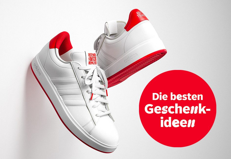 Zwei weiße Sneaker mit roter Sohle, daneben ein roter Kreis mit dem Text "Die besten Geschenkideen".