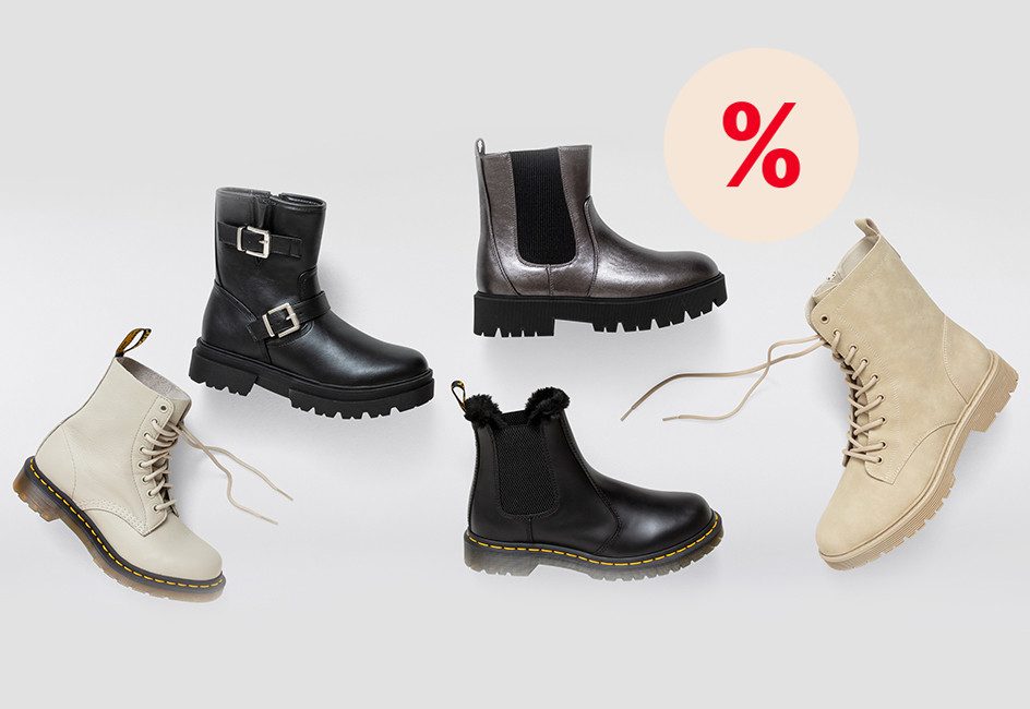 verschiedene Winterboots für Damen vor grauem Hintergrund, %-Zeichen