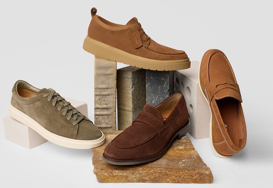 verschiedene Herrenschuhe vor grauem Hintergrund