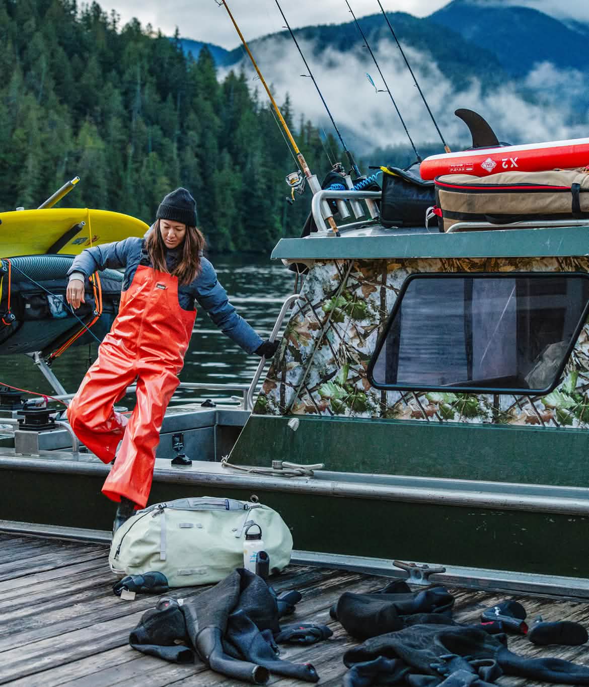 A person jumps from a boat to the dock. 