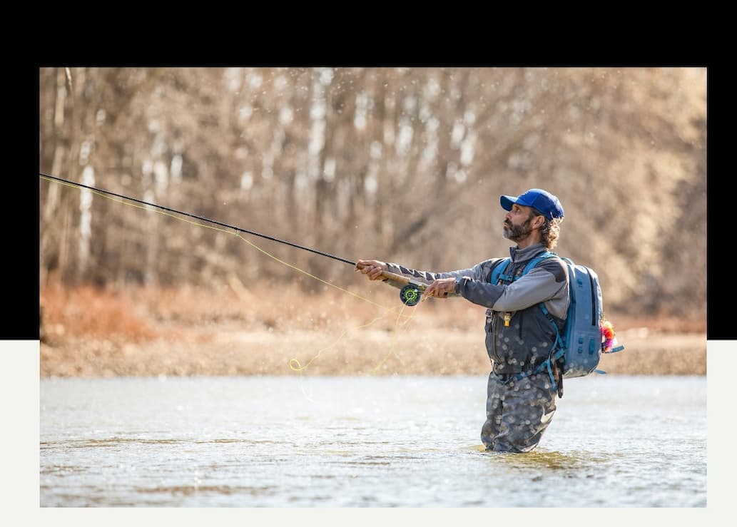 An angler makes a cast on a cold day. 