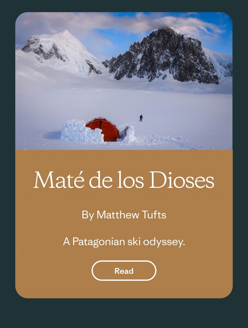 A person skis away from a tent surrounded by snow. 