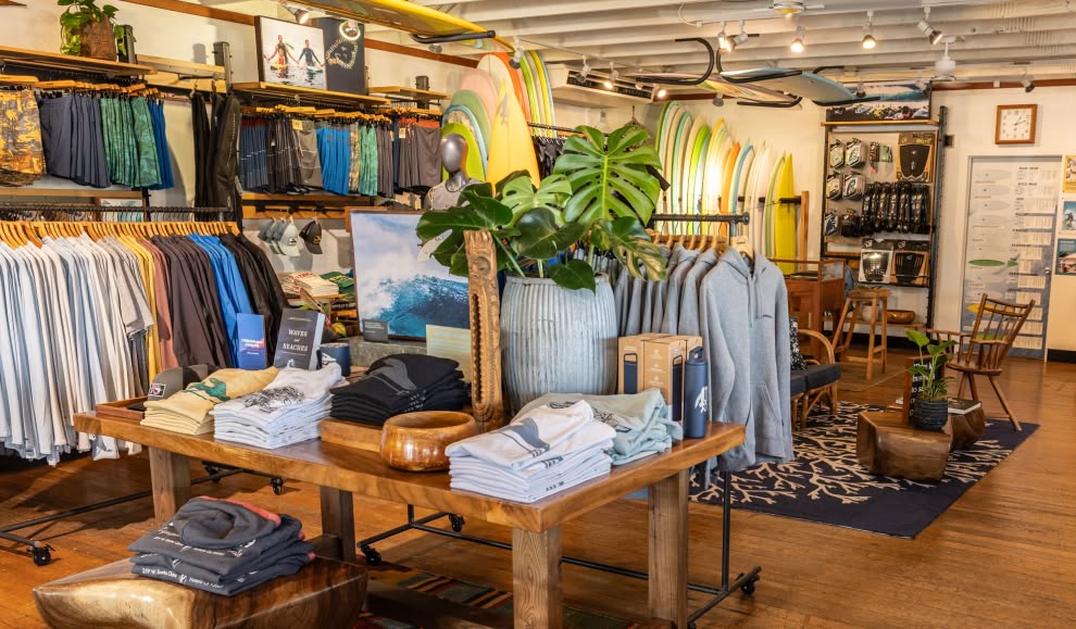 Clothing on racks inside a Patagonia store.