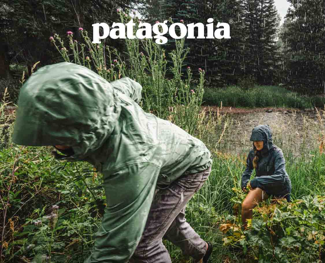  Patagonia. Two people hiking in the rain. 