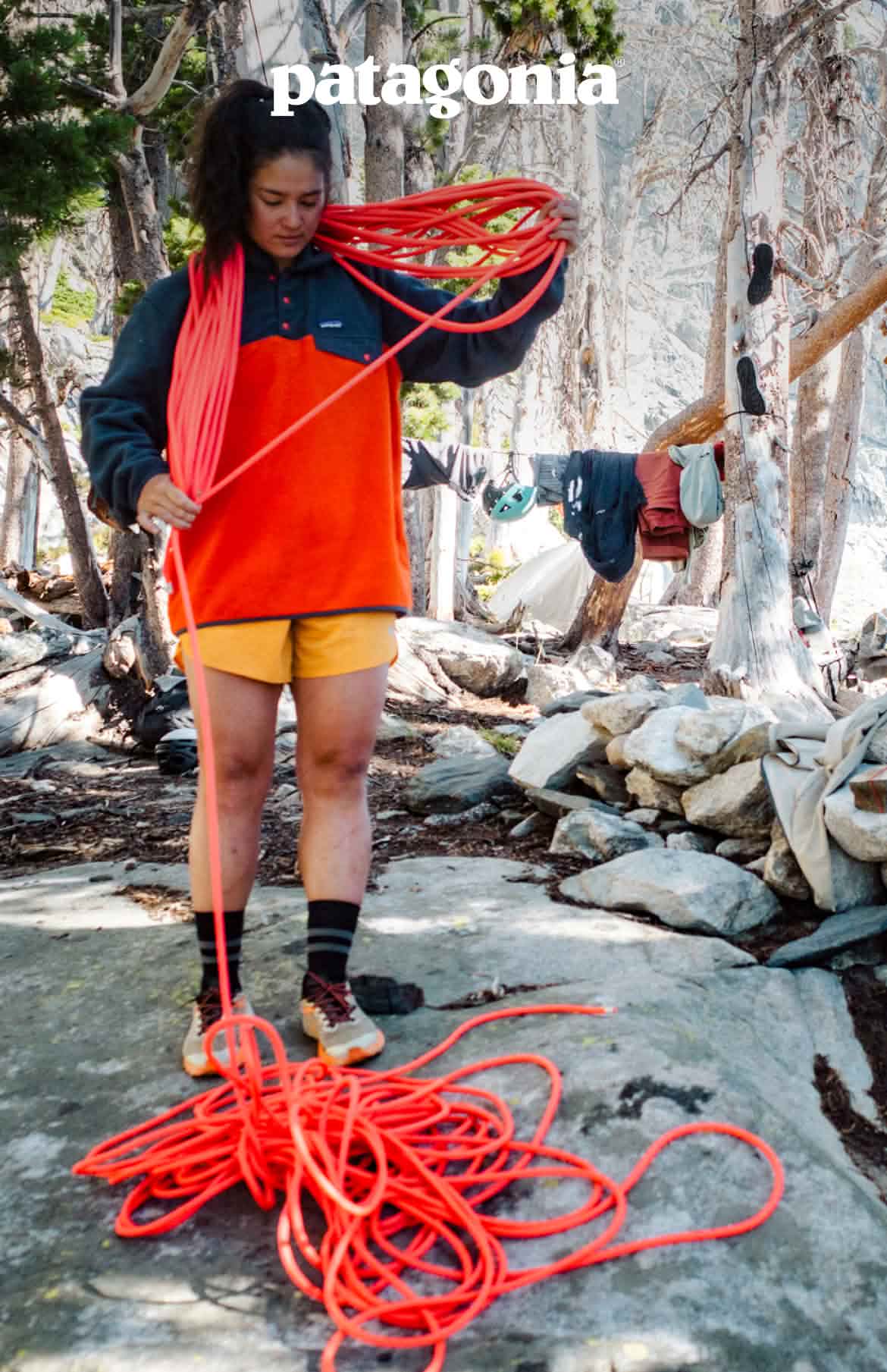 Patagonia. A person organizes climbing rope in a campsite.