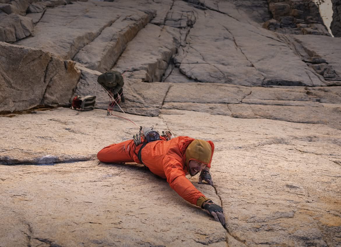 Looking down on  two climbers high on a big wall.