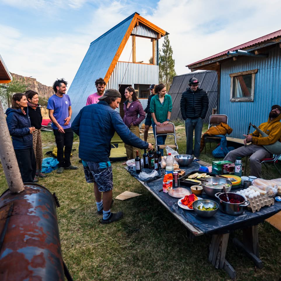 A climber examines the anchor nest above their portaledge.