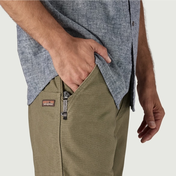 Two closeups of a person modeling pants