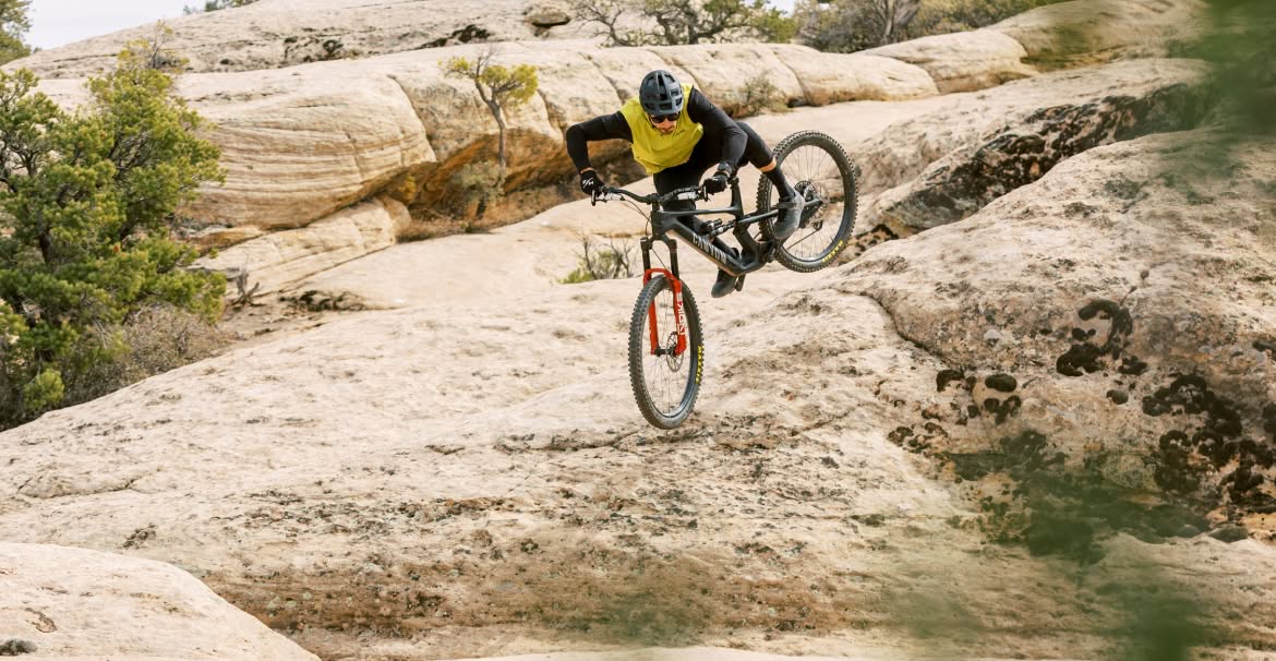 Braydon Bringhurst jumps over rocks on his bike. 