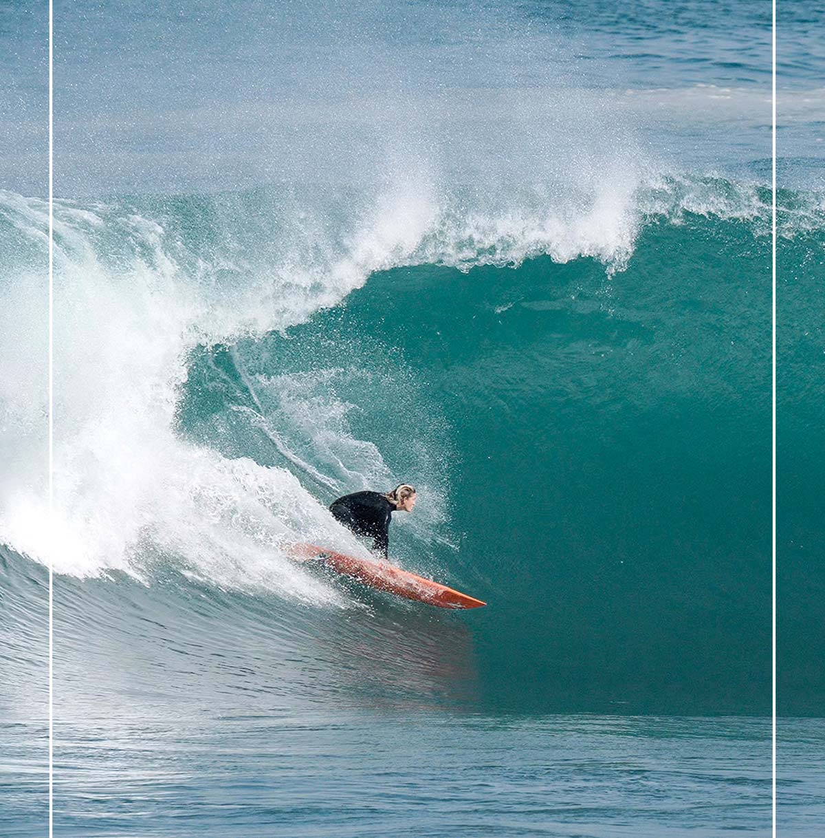 A surfer going left.
