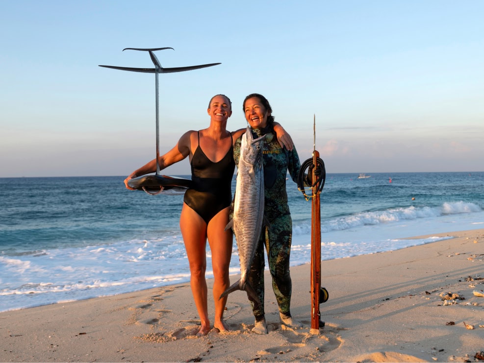 Two friends on a tropical beach.