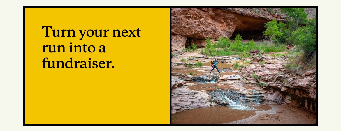 A hiker traverses a water crossing in Grand Staircase-Escalante National Monument.
