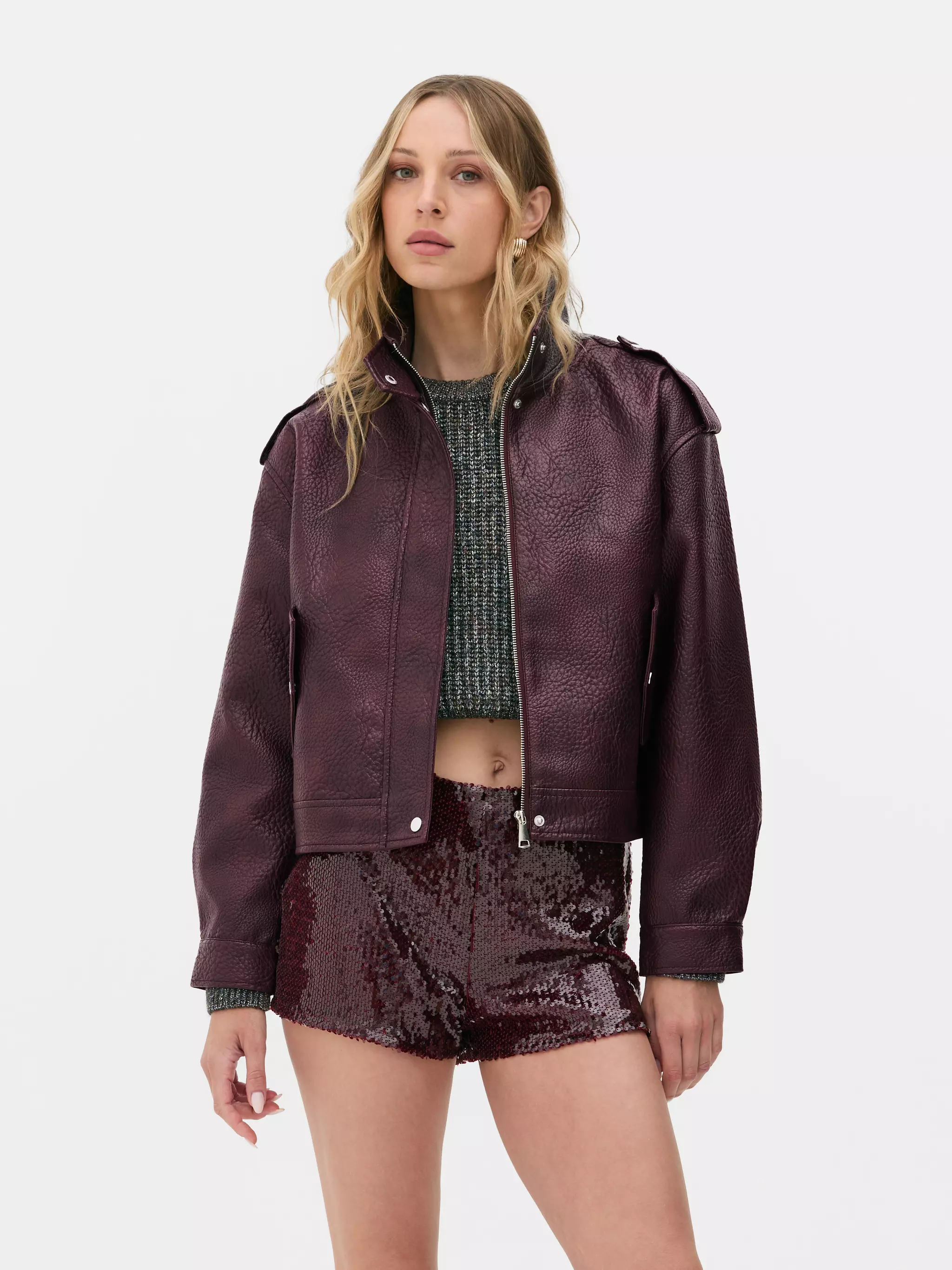 Model wearing Burgundy Rita Ora Funnel Neck Faux Leather Jacket