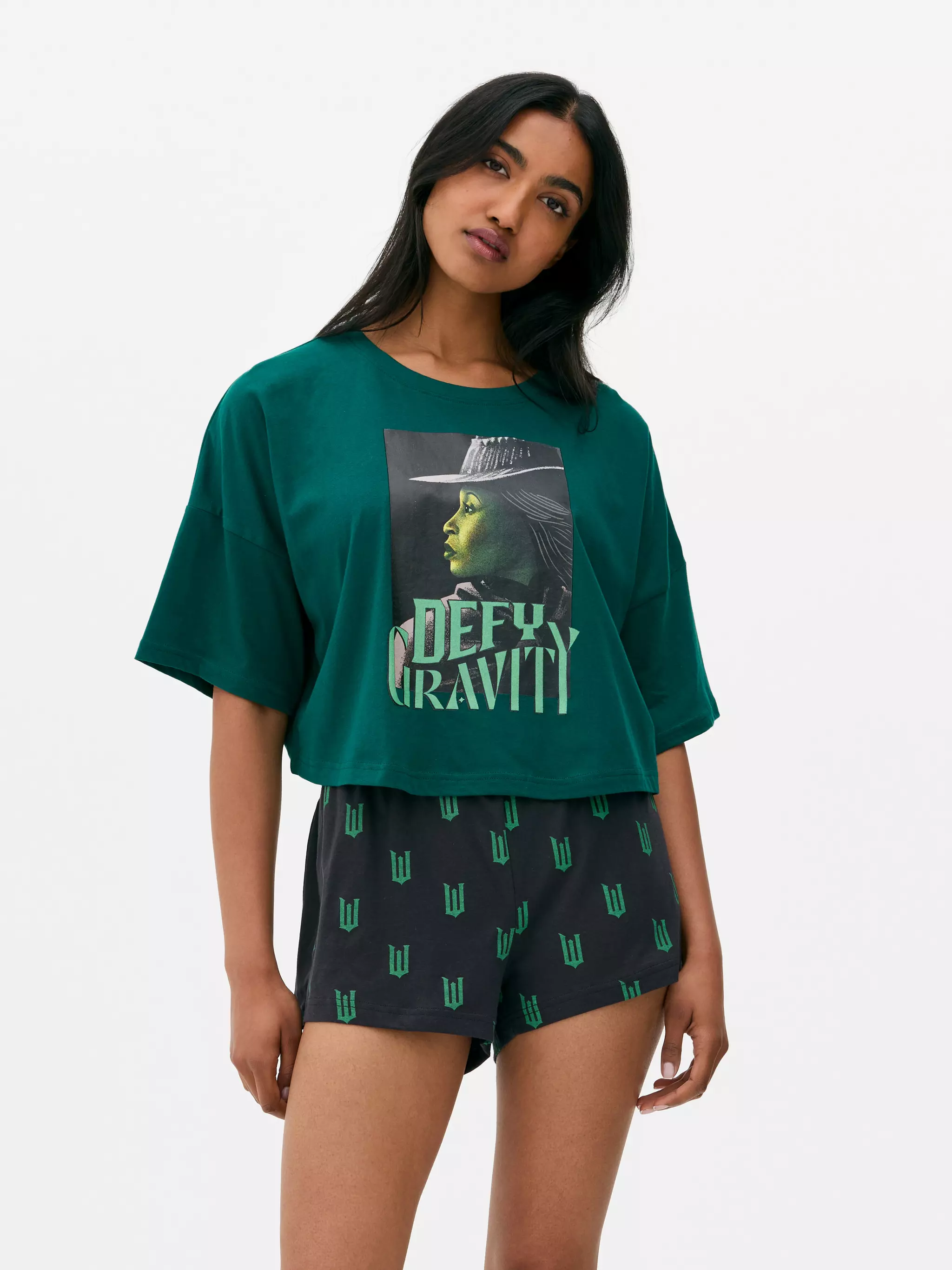 Model wearing Green Wicked x Primark Witches Of Oz Top and Shorts Pyjamas