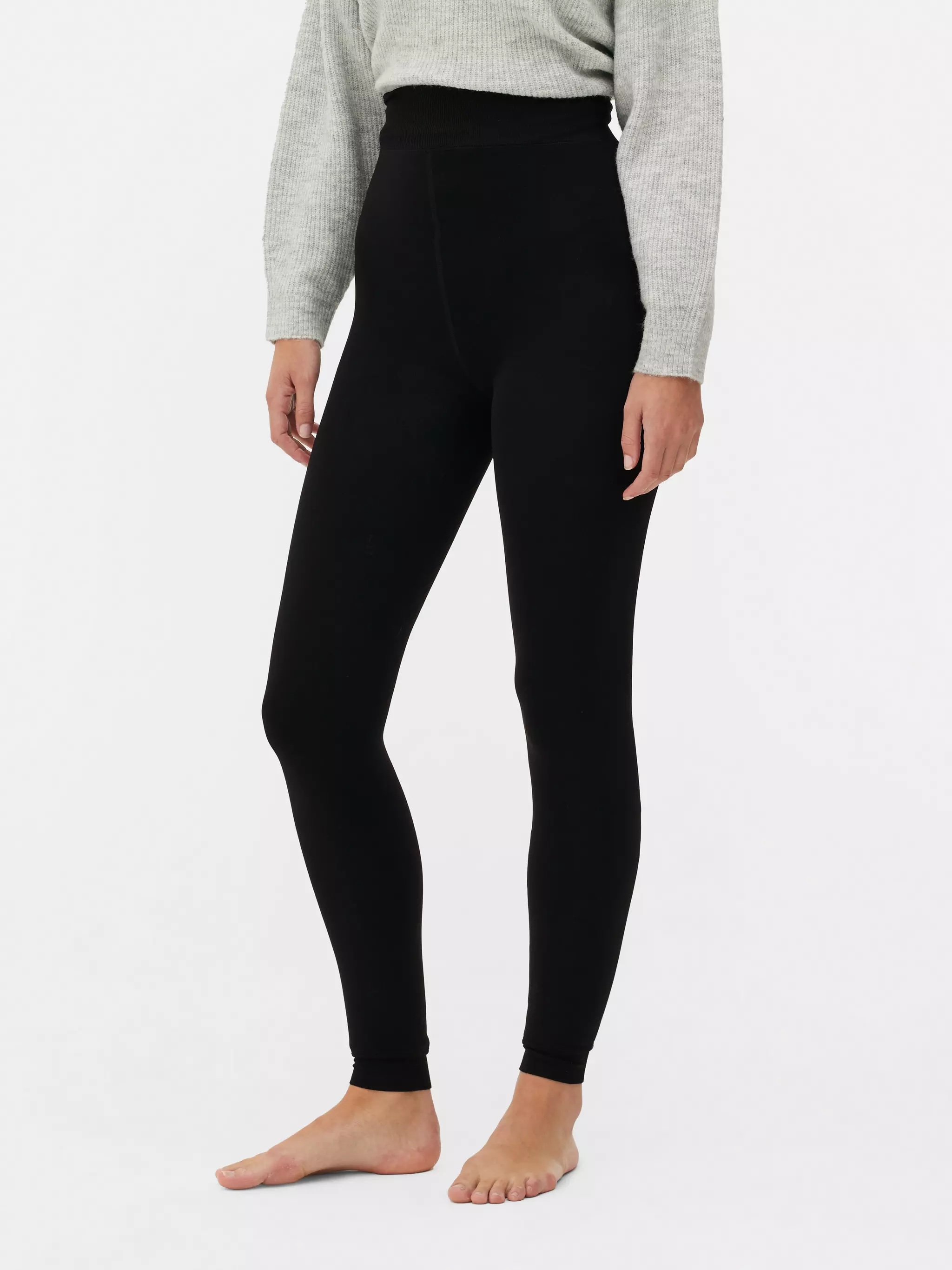 Woman wearing black velvet plush lined leggings in 