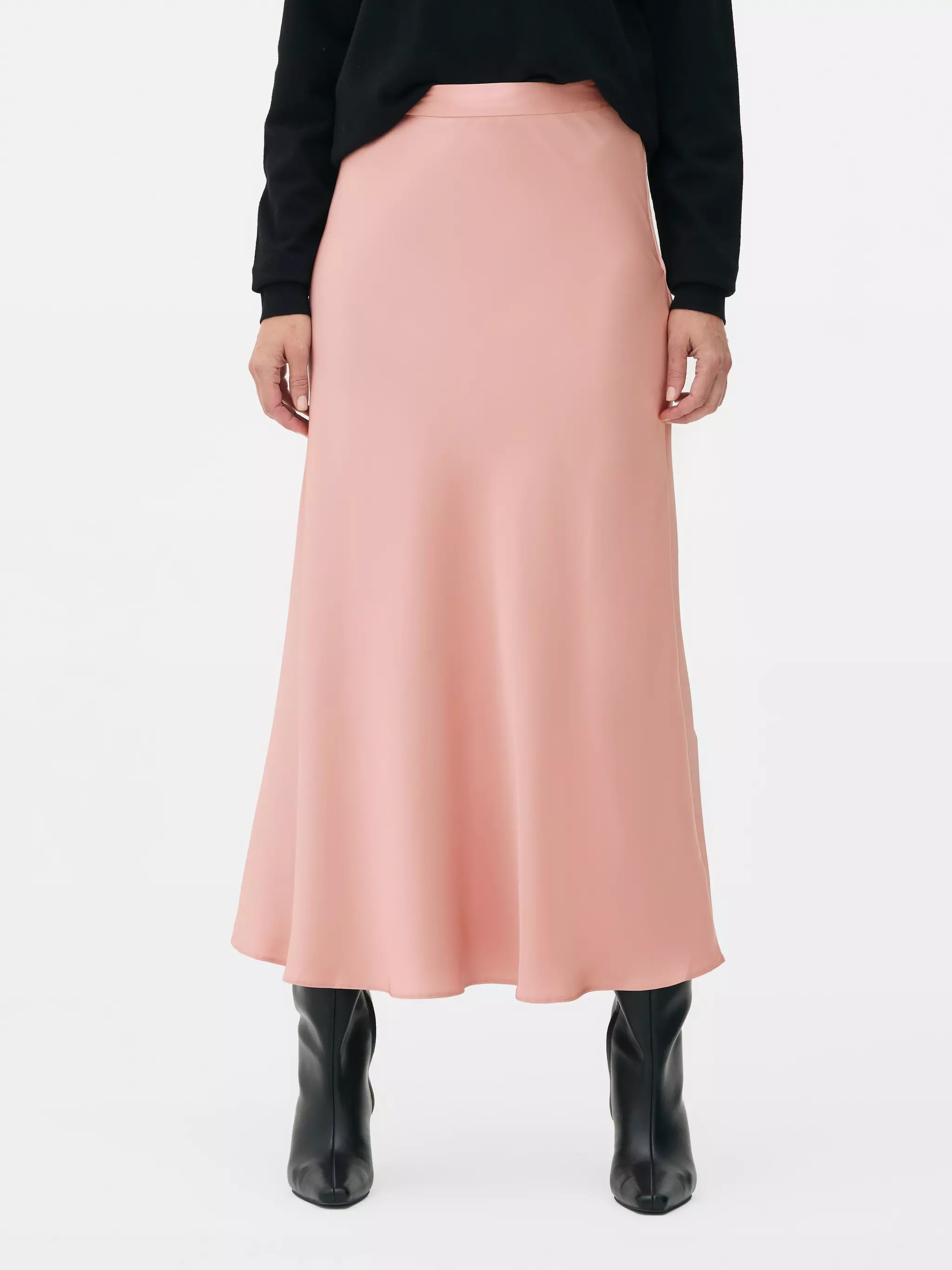 Woman wearing Satin Midi Skirt in Blush Pink