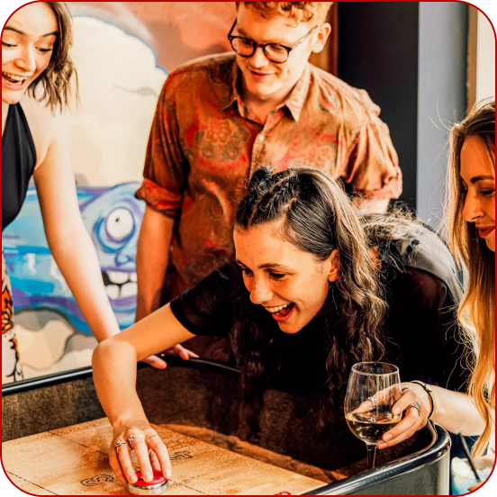 Group of friends playing shuffleboard 