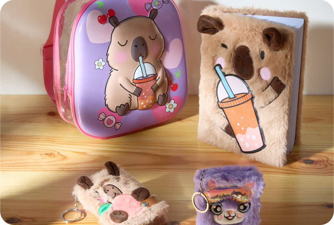 A table showcasing a themed backpack and teddybear notebook 