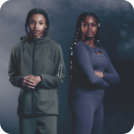 2 older children modelling green and blue activewear sets